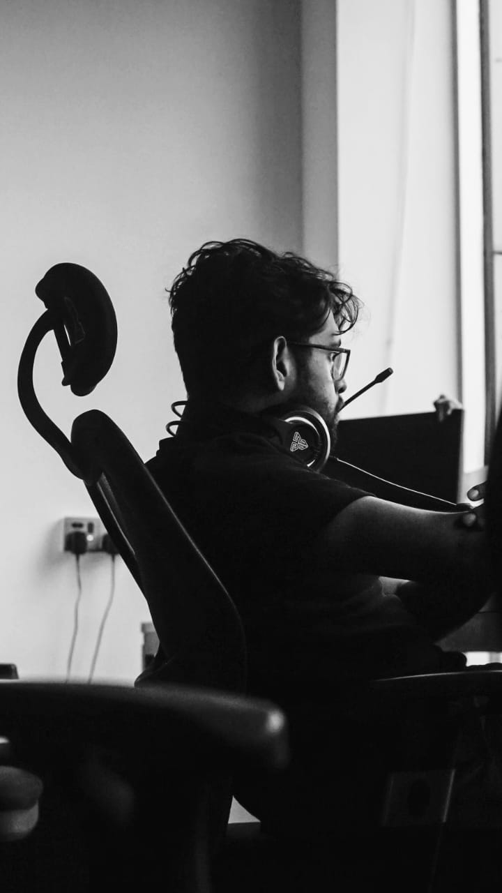 A woman in a white shirt and black pants.
